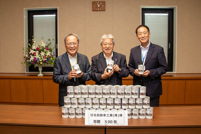 日北自動車工業㈱様よりパン500缶寄贈